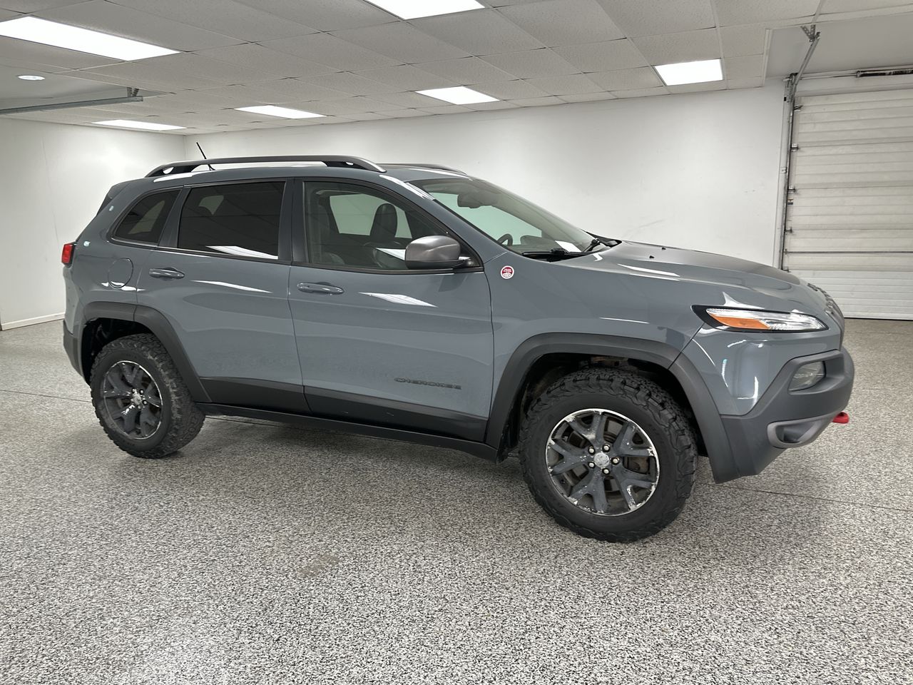 Used 2015 Jeep Cherokee Trailhawk with VIN 1C4PJMBS6FW606376 for sale in Kalkaska, MI